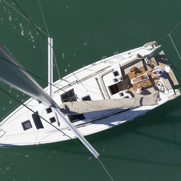 a green boat on a body of water