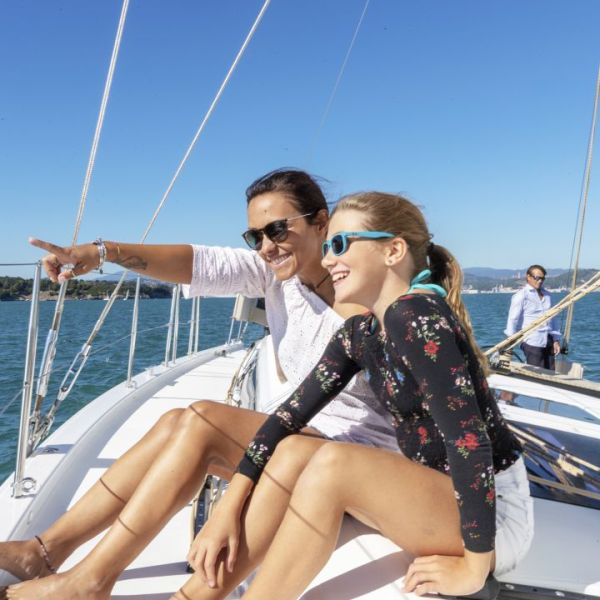 a man and a woman sitting on a boat