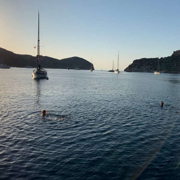 a small boat in a large body of water