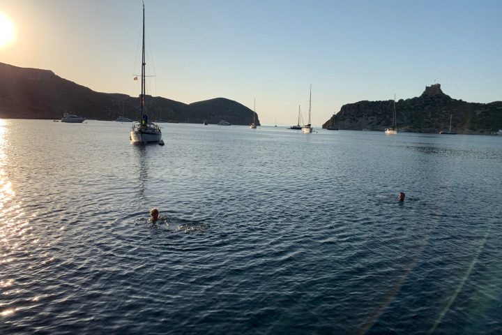 a small boat in a large body of water