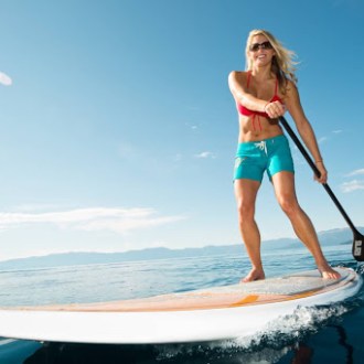 a woman standing on a beach