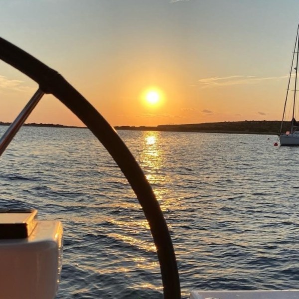 a close up of a boat next to a body of water