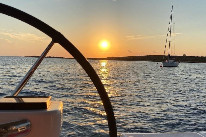 a close up of a boat next to a body of water