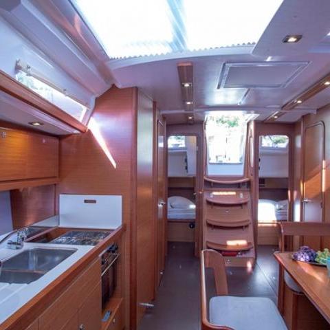 a kitchen with wooden cabinets and a window