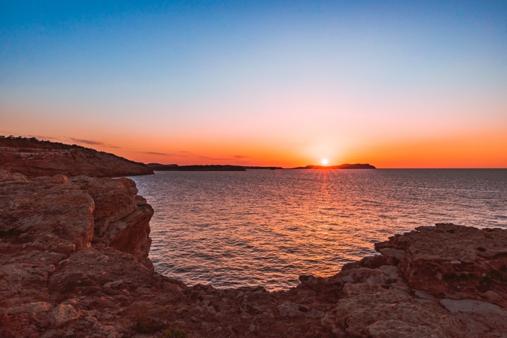 a sunset over a body of water